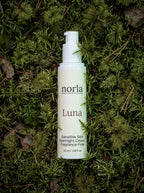 Luna Sensitive Skin Overnight Cream 50 ml by Norla, fragrance-free airless pump bottle lying on green moss
